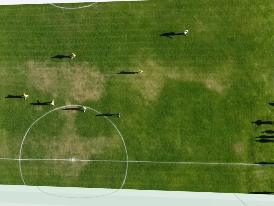 A match video standing on a 3D pitch, the pitch lines drawn in front of it